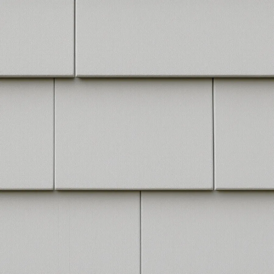 Close view of warm gray painted siding pieces with narrow straight vertical joints where their ends meet